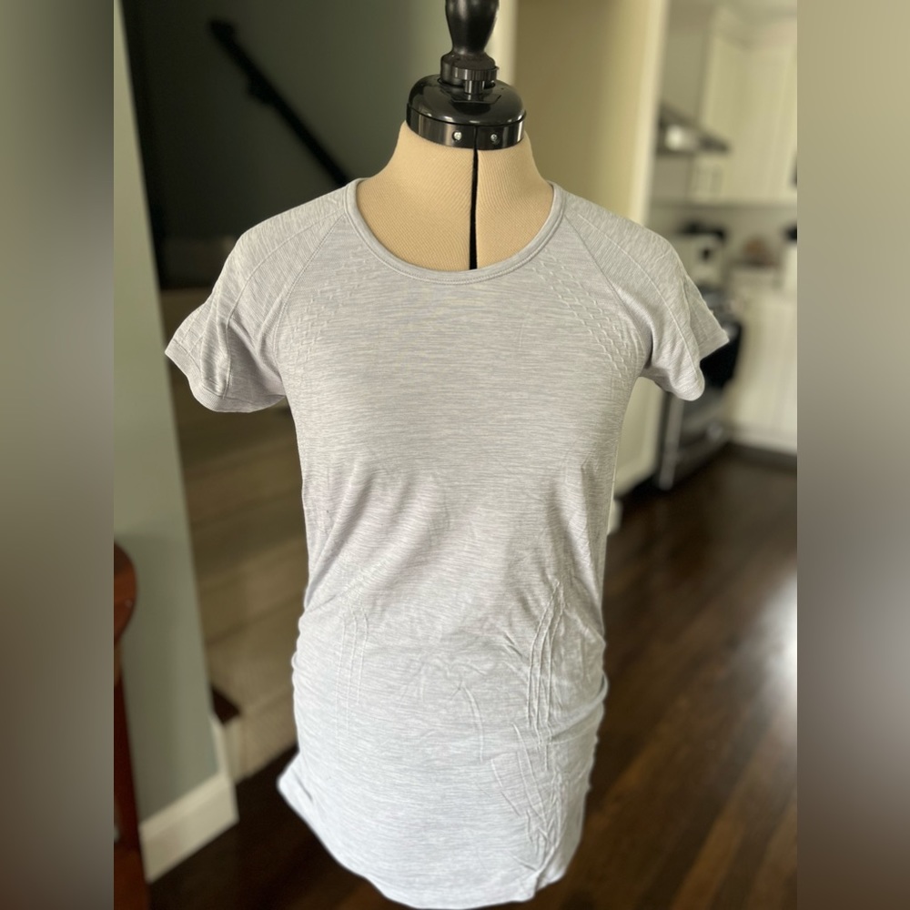 A light grey stretchy synthetic short sleeve tee.